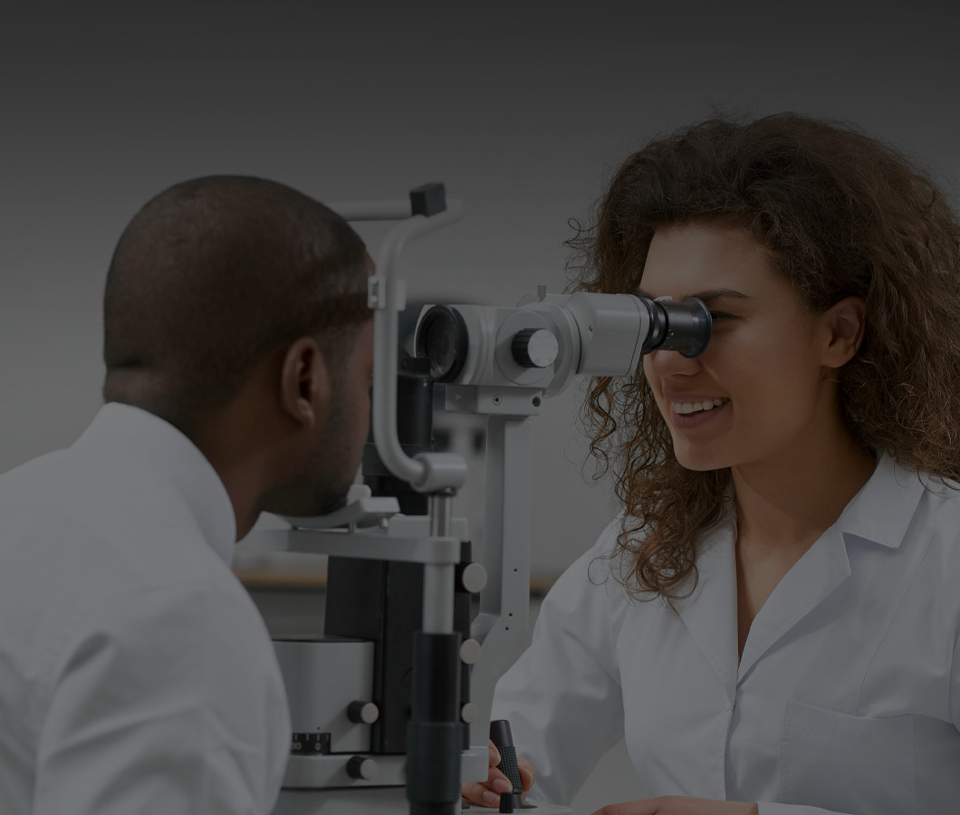The doctor is checking her patient's eyes